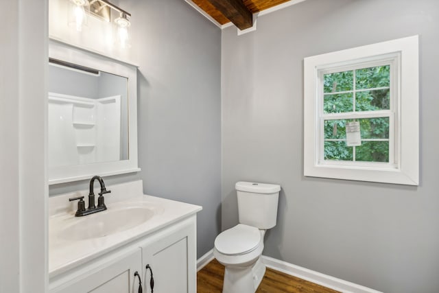 bathroom with a shower, vanity, beamed ceiling, wood-type flooring, and toilet