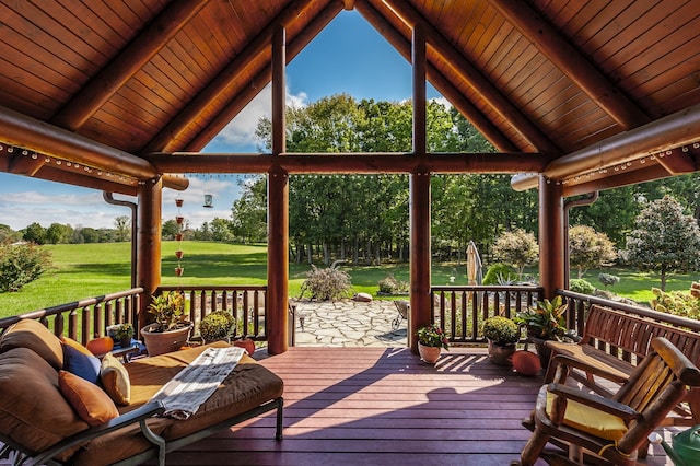 wooden terrace with a lawn