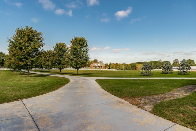 view of home's community with a lawn