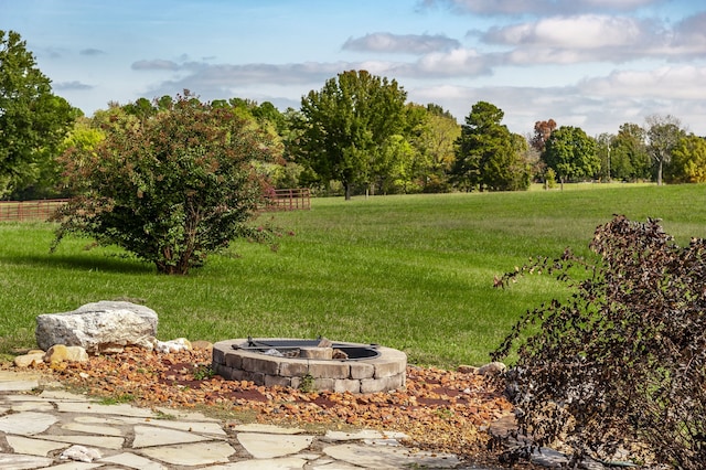 view of yard with a rural view and an outdoor fire pit