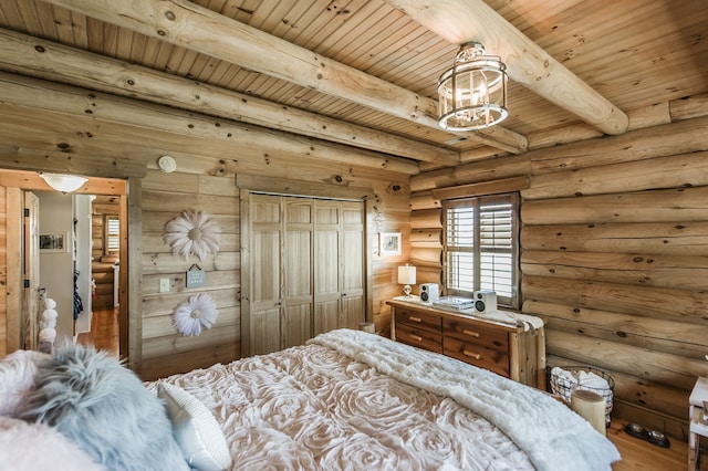 bedroom featuring wood ceiling, a closet, beam ceiling, hardwood / wood-style floors, and rustic walls