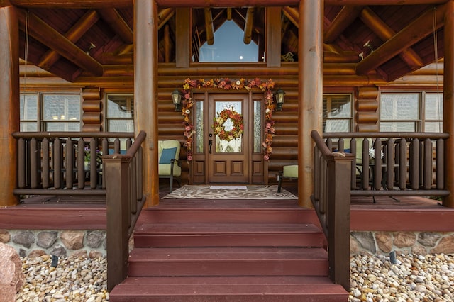 doorway to property with a porch