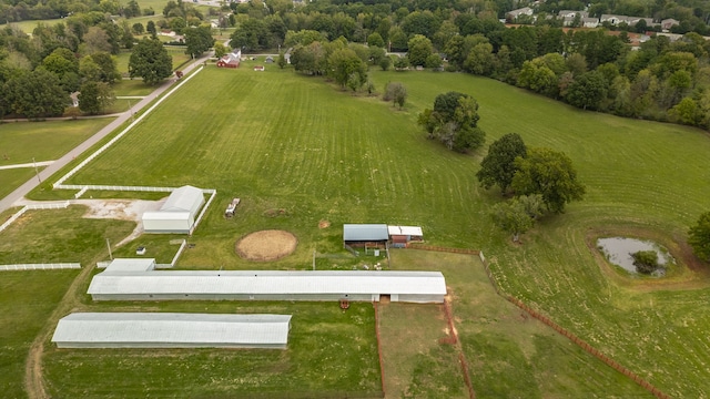 birds eye view of property with a rural view