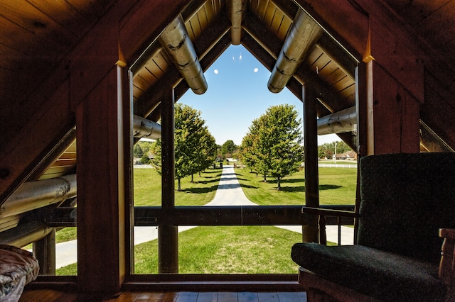 sunroom with lofted ceiling with beams and wooden ceiling