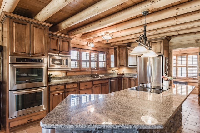 kitchen featuring wood ceiling, dark stone countertops, a kitchen island, beamed ceiling, and stainless steel appliances