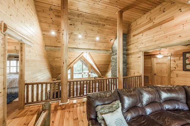 living room featuring high vaulted ceiling, wooden ceiling, hardwood / wood-style flooring, and wooden walls