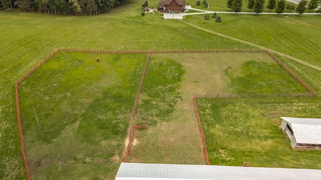 birds eye view of property with a rural view