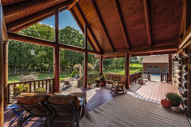 wooden terrace with a garage