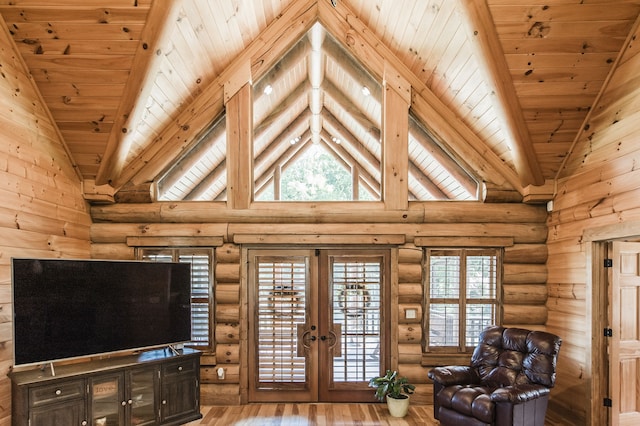 living room featuring wood ceiling, wood-type flooring, log walls, high vaulted ceiling, and french doors