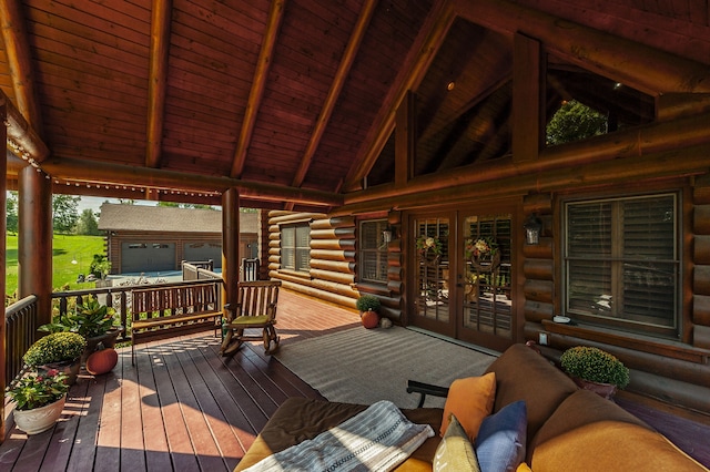 wooden terrace featuring french doors and an outdoor living space