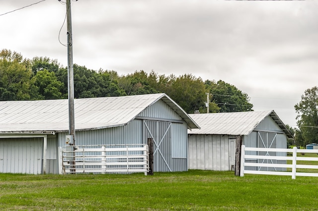 view of outbuilding featuring a yard