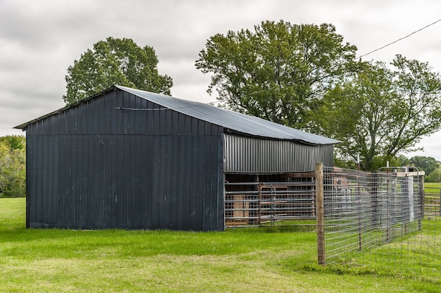 view of outbuilding with a lawn