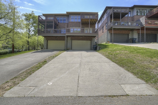 view of front of home with a balcony and a garage