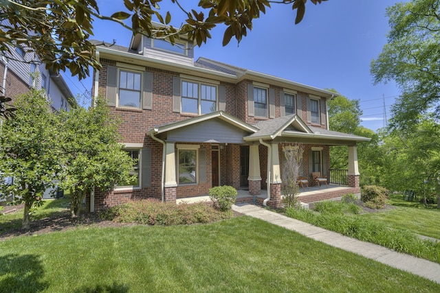 view of front of home with a front lawn and a porch