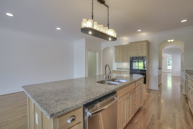 kitchen with sink, stainless steel dishwasher, light hardwood / wood-style flooring, a center island with sink, and black double oven