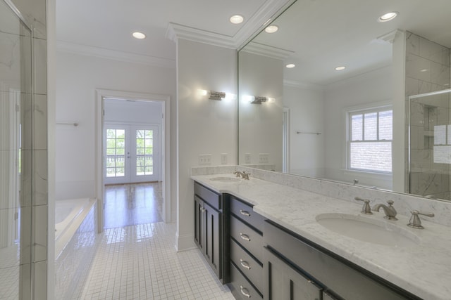 bathroom with ornamental molding, shower with separate bathtub, tile patterned floors, and vanity