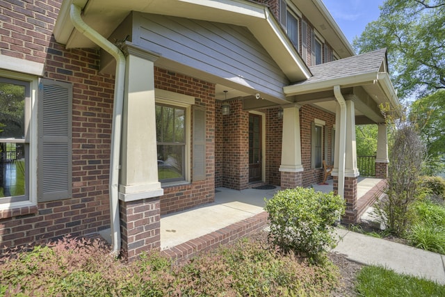 view of exterior entry featuring a porch