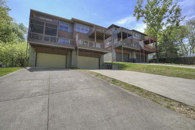 view of front facade with a garage and a front lawn