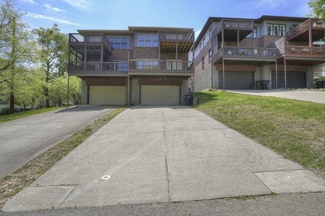 view of front of home featuring a balcony and a garage