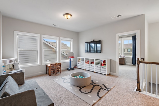 carpeted living room featuring a wealth of natural light