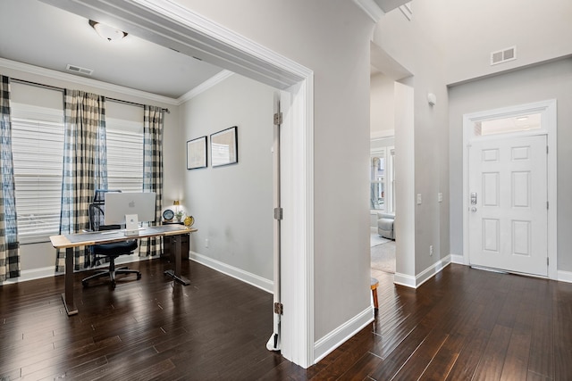 home office with dark hardwood / wood-style floors and crown molding