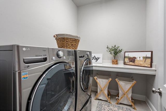 clothes washing area with independent washer and dryer