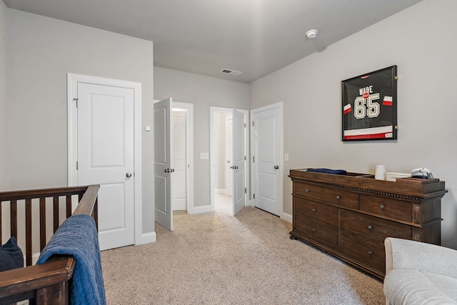 bedroom with light colored carpet