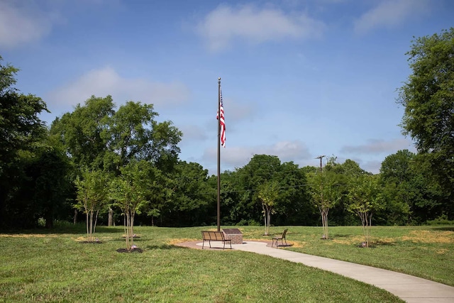 surrounding community featuring a lawn