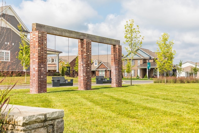 rear view of property featuring a yard