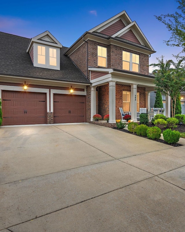 view of front facade featuring a garage and a porch