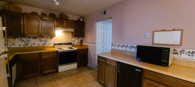 kitchen featuring white range with electric cooktop and light tile patterned floors