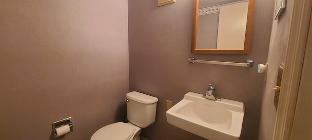 bathroom with toilet and sink