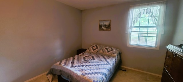 bedroom with light carpet