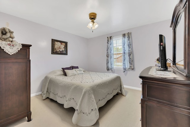 bedroom with light colored carpet