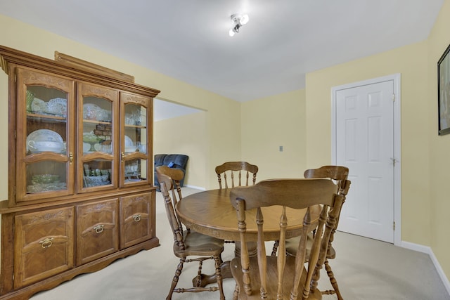 dining area with light carpet