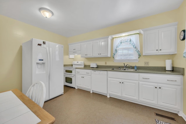 kitchen featuring white appliances, white cabinetry, and sink