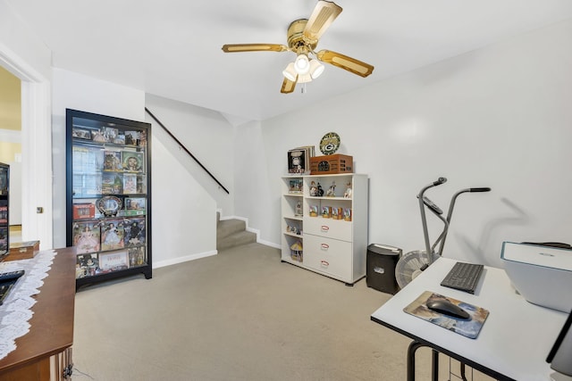 carpeted home office with ceiling fan