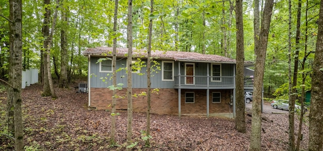 view of side of property featuring a balcony