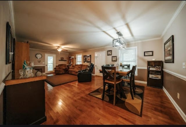 dining area featuring ceiling fan, ornamental molding, and hardwood / wood-style floors