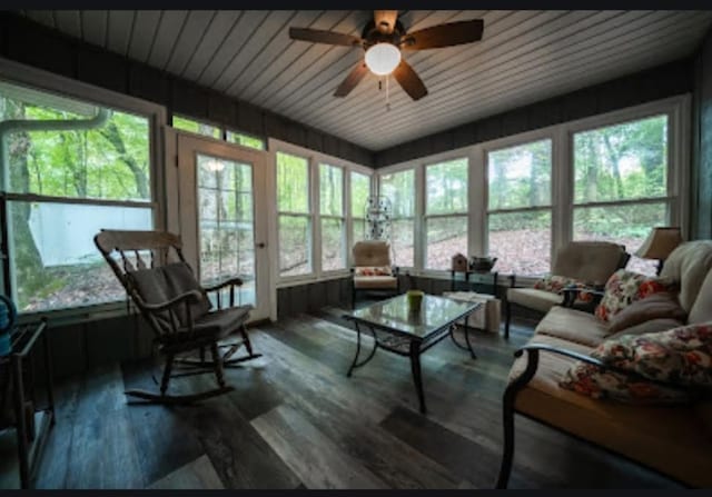 sunroom featuring wood ceiling, ceiling fan, and plenty of natural light