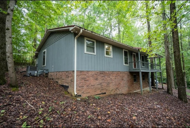 view of side of home with a balcony