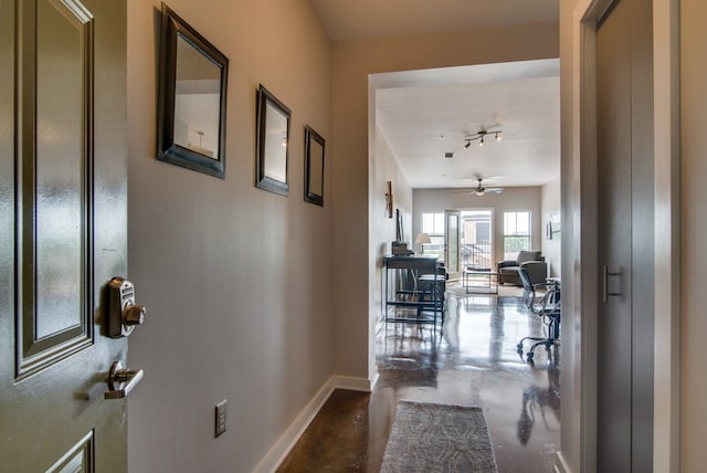 hall featuring concrete floors