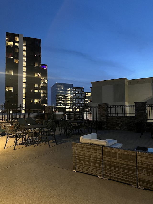 view of patio terrace at dusk