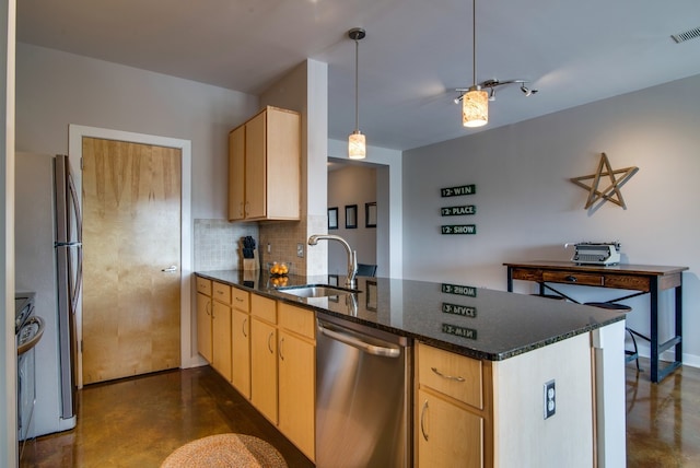 kitchen with tasteful backsplash, sink, kitchen peninsula, appliances with stainless steel finishes, and light brown cabinets