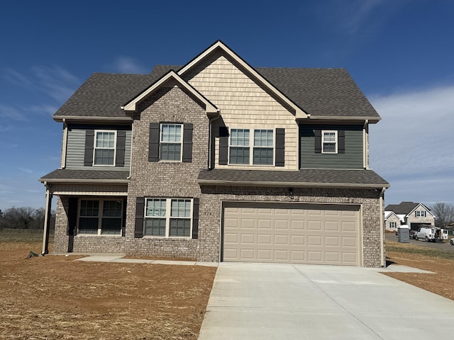 view of front facade featuring concrete driveway, roof with shingles, brick siding, and an attached garage