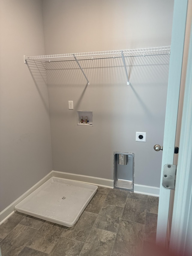 3261 Volta Rd, Christiana, TN 37037 - washroom with washer hookup, electric dryer hookup, baseboards, and dark stone finish flooring