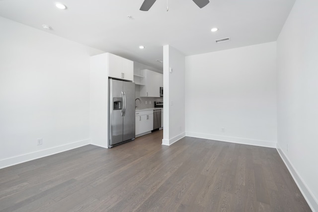 interior space with sink, ceiling fan, and hardwood / wood-style flooring