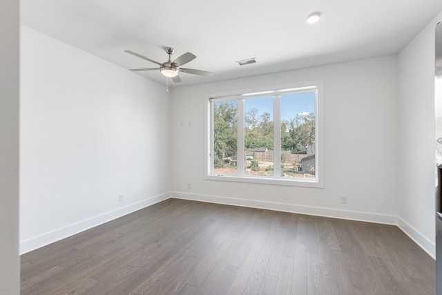 unfurnished room featuring ceiling fan and dark hardwood / wood-style floors