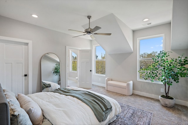 carpeted bedroom with ceiling fan and multiple windows