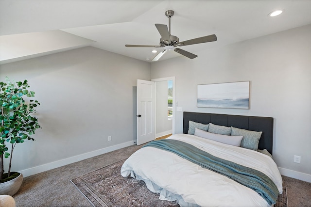 carpeted bedroom featuring vaulted ceiling and ceiling fan